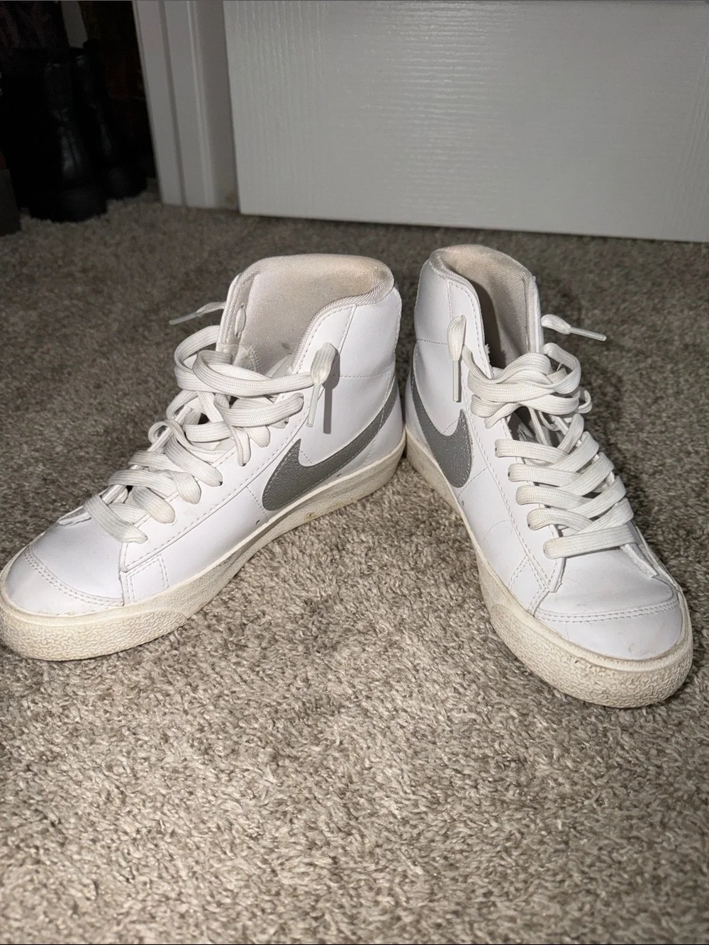 Nike White High-Top Sneakers with Silver Swoosh